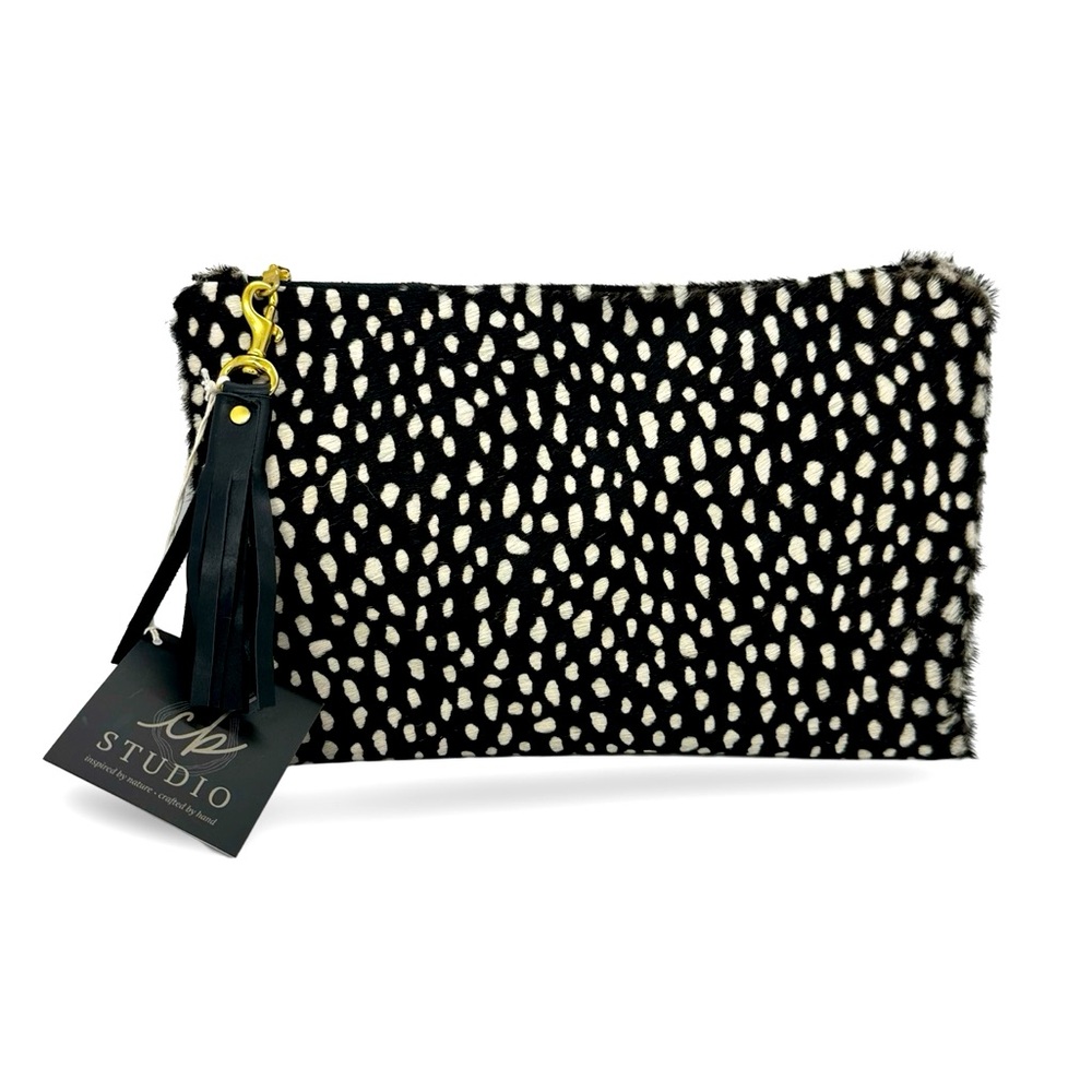 Handmade women owned one-of-a-kind cowhide clutch